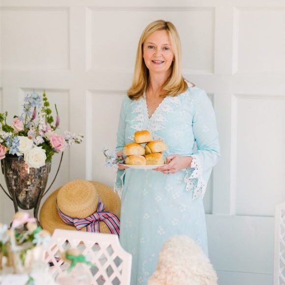 kentucky derby party lady in blue dress holding rolls