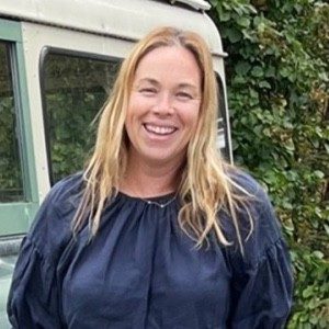 beth sheeler standing next to truck