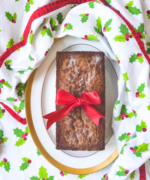 cranberry bread with red bow on holly berry tablecloth