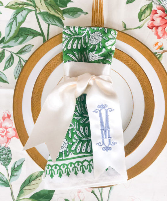 monogrammed napkin twilly ribbon on floral napkin and floral tablecloth