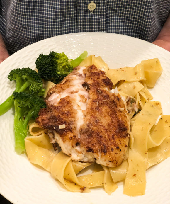 snapper piccata on whote plate with broccoli side