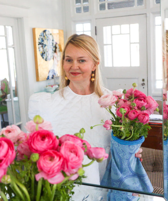 lydia menzies holding bouquet of pink ranunculus