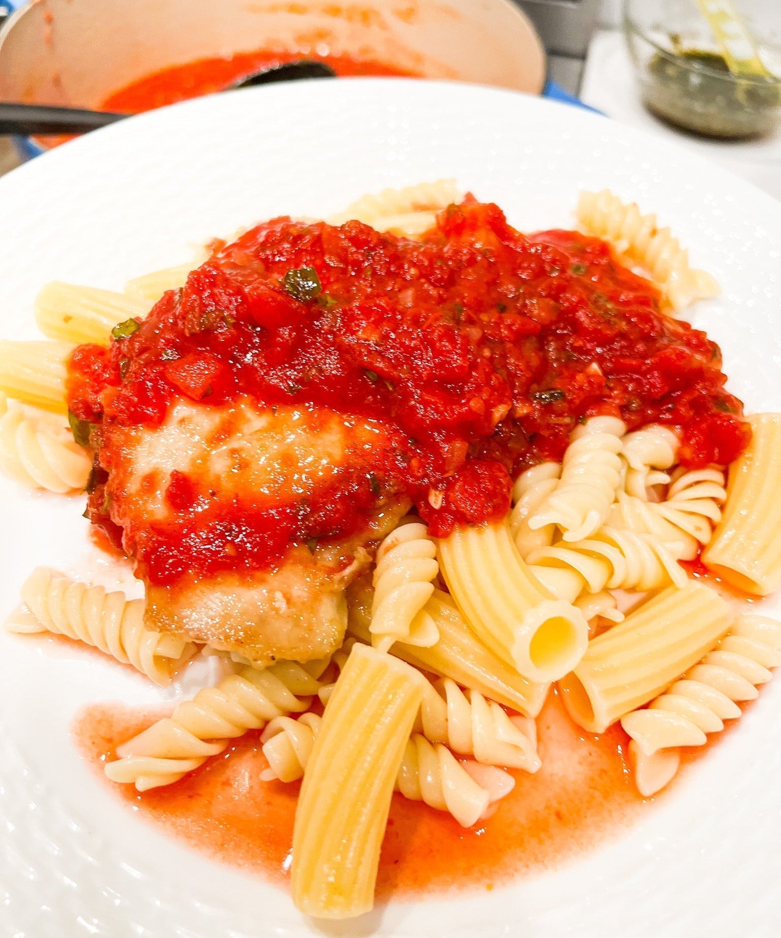 chicken with marinara sauce served over penne pasta