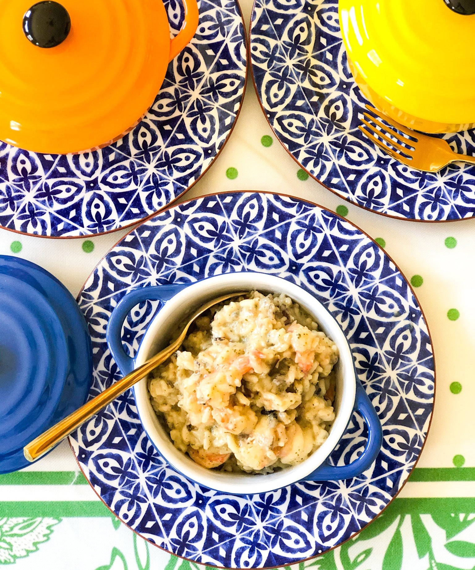 wild rice shrimp casserole in blue and white bowl with spoon