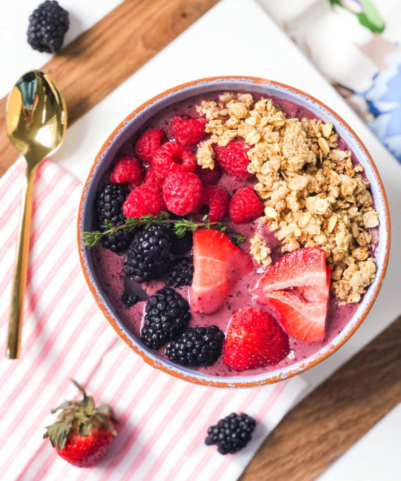 acai bowl recipe with strawberries blueberries raspberries granola and thyme