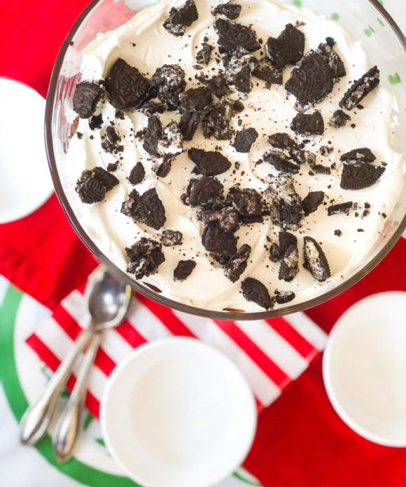 Brownie trifle made bourbon, layered with chocolate pudding, cool whip, and crushed Oreos