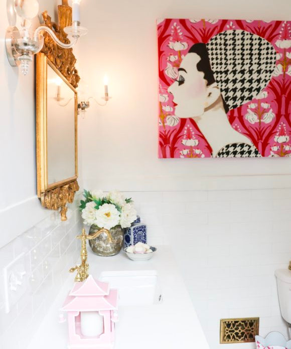 bathroom countertop side view with ashley longshore painting on wall