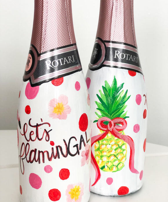 mini champagne bottles hand painted with flamingos and pineapples for galentine's day