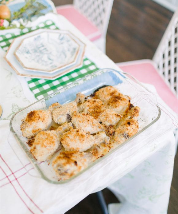 chicken in a glass dish placed on corner of the table