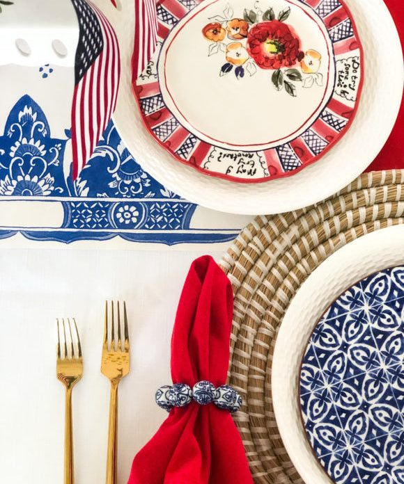 red white and blue table setting with american flag