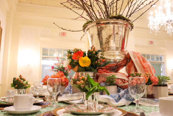 table-setting-large-silver-urn-with branches-surrounded by flowers