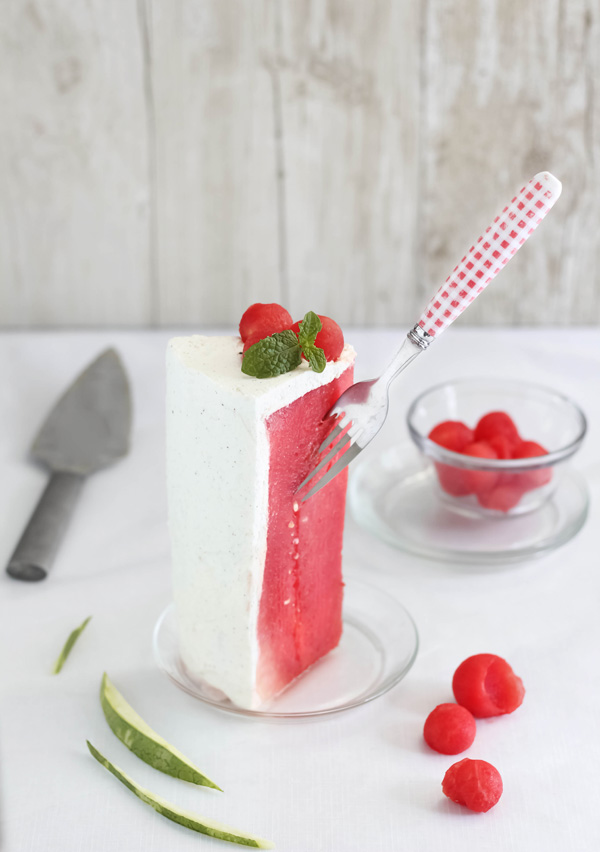 slice of fresh watermelon cake with fork stuck in the watermelon
