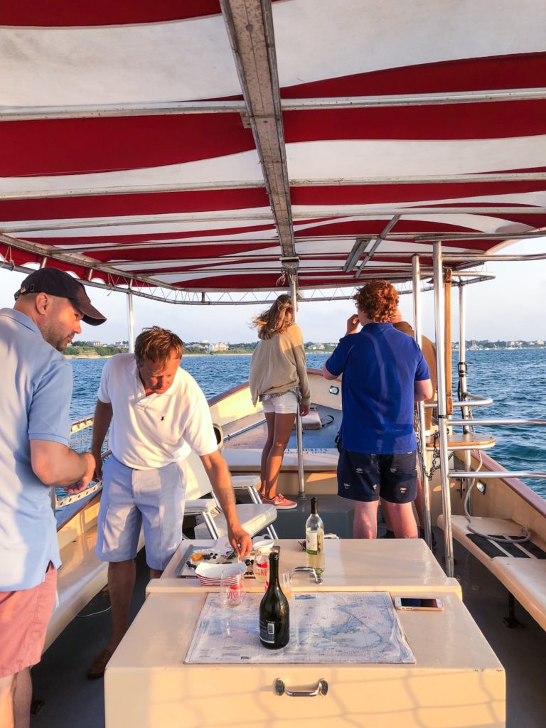 Nantucket sunset cruise aboard the Minke boat with red and white striped top