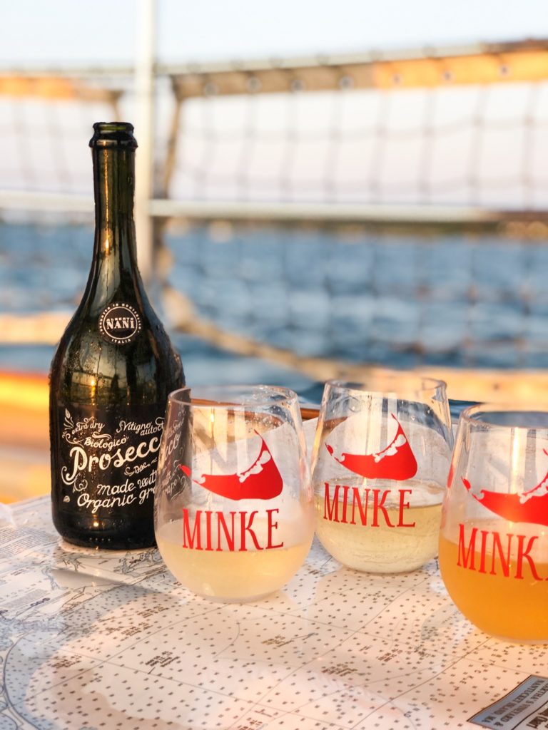 Bottle of Prosecco with three acrylic wine tumblers customized with Minke and Nantucket Island