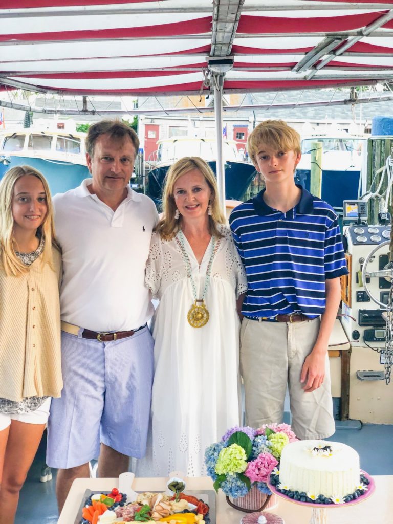 Family with husband wife daughter son on Nantucket harbor cruise aboard Minke boat 