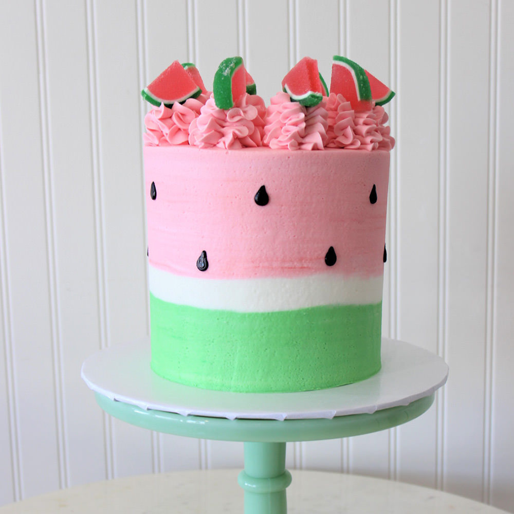 watermelon birthday cake with green white and pink and black seeds