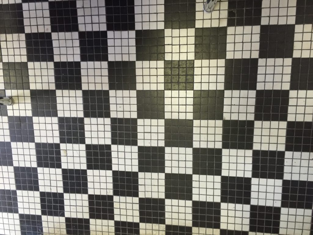 black and white tile floor in checkerboard pattern