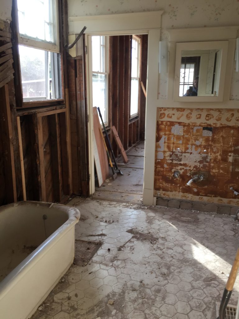 guest bathroom in 100 year old house in mid demolition for restoration