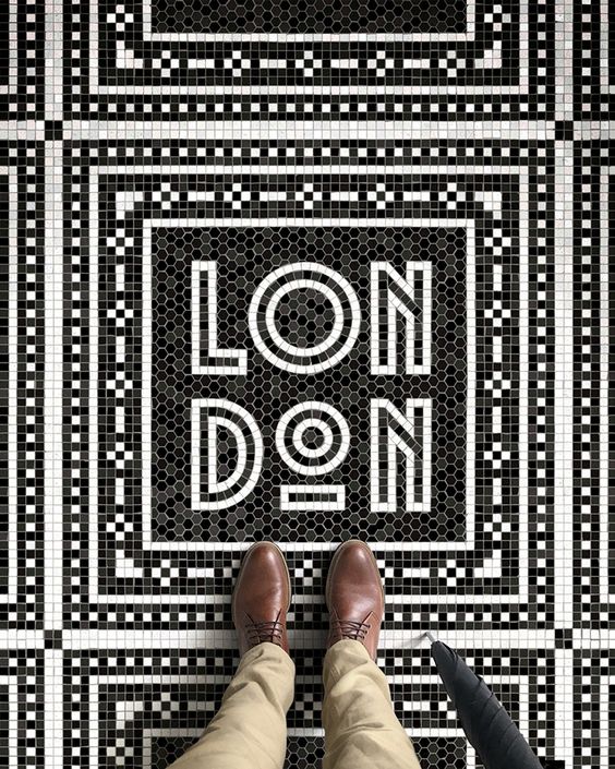 black and white tile floor mosaic spelling out london