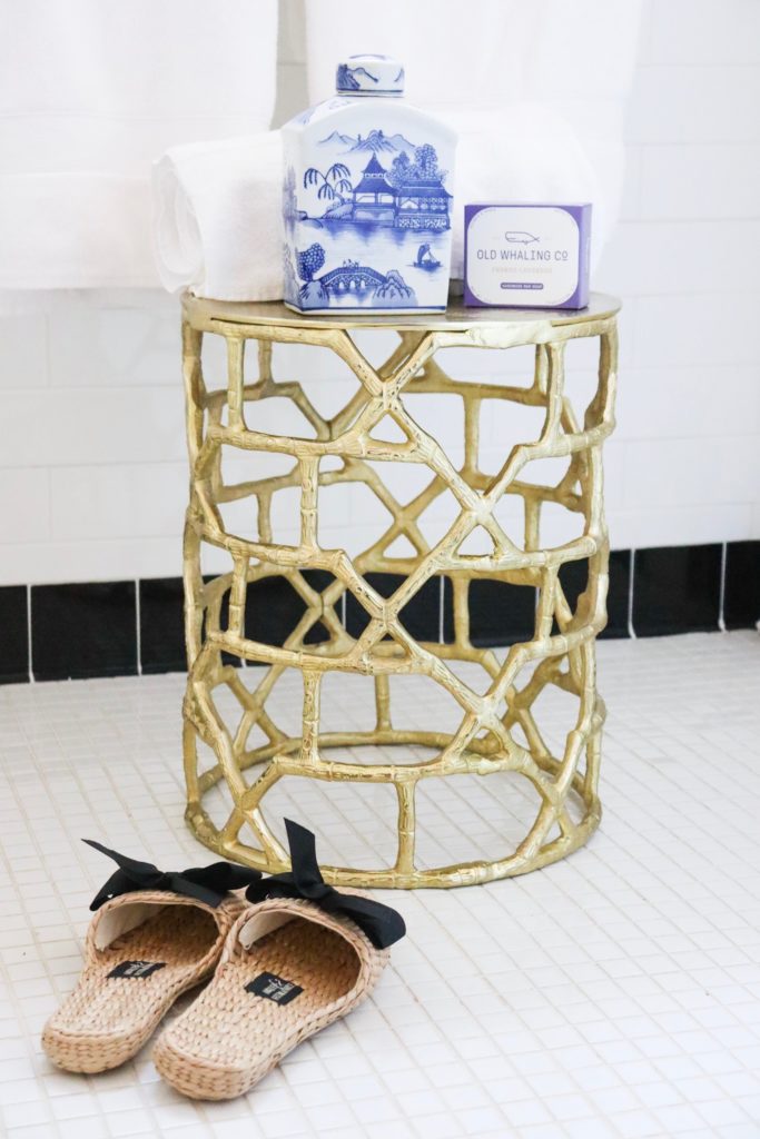 bathroom gold bamboo table with towel and soap