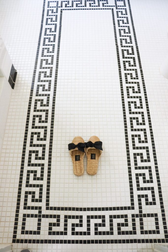 white tile floor with black greek key pattern
