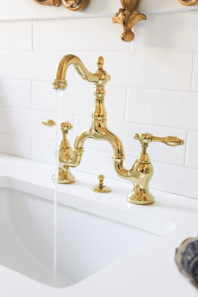 brass hardware faucet with water running