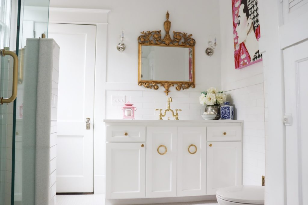 white bathroom remodel with antique brass mirror ashley longshore painting glass shower