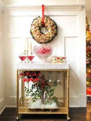 bar cart decorated for Christmas with vintage jewelry wreath by parker kennedy living