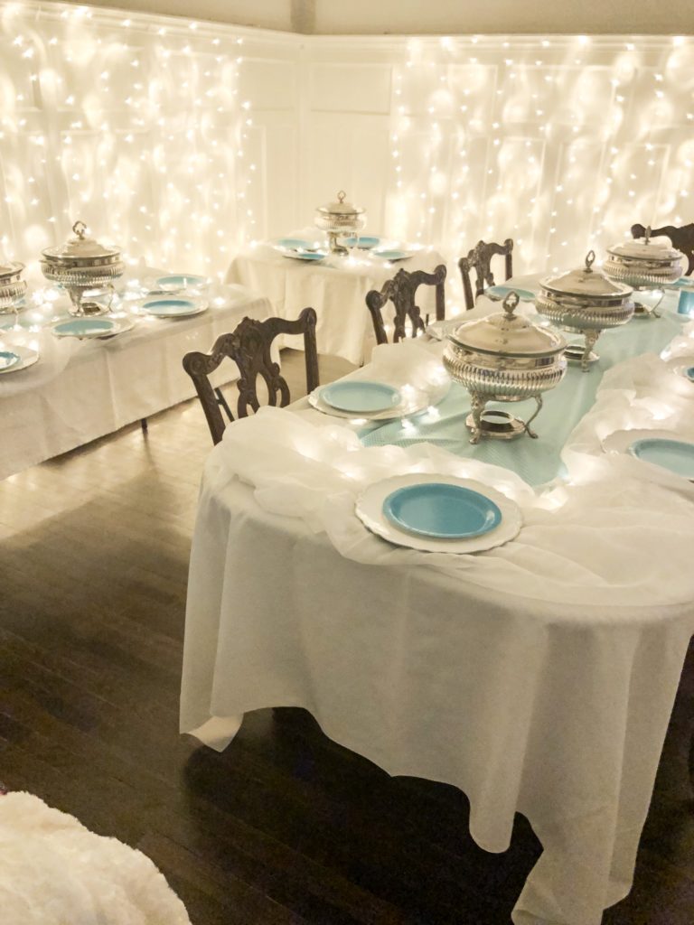 Fondue Supper Club for winter with icicle lights and silver fondue pots