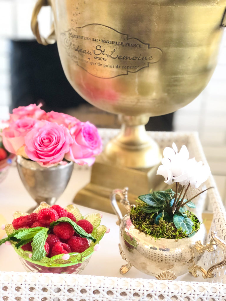 loving cups grouped on bar cart with raspberries and mint