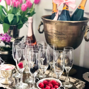 champagne brunch drink station set with berries and flutes