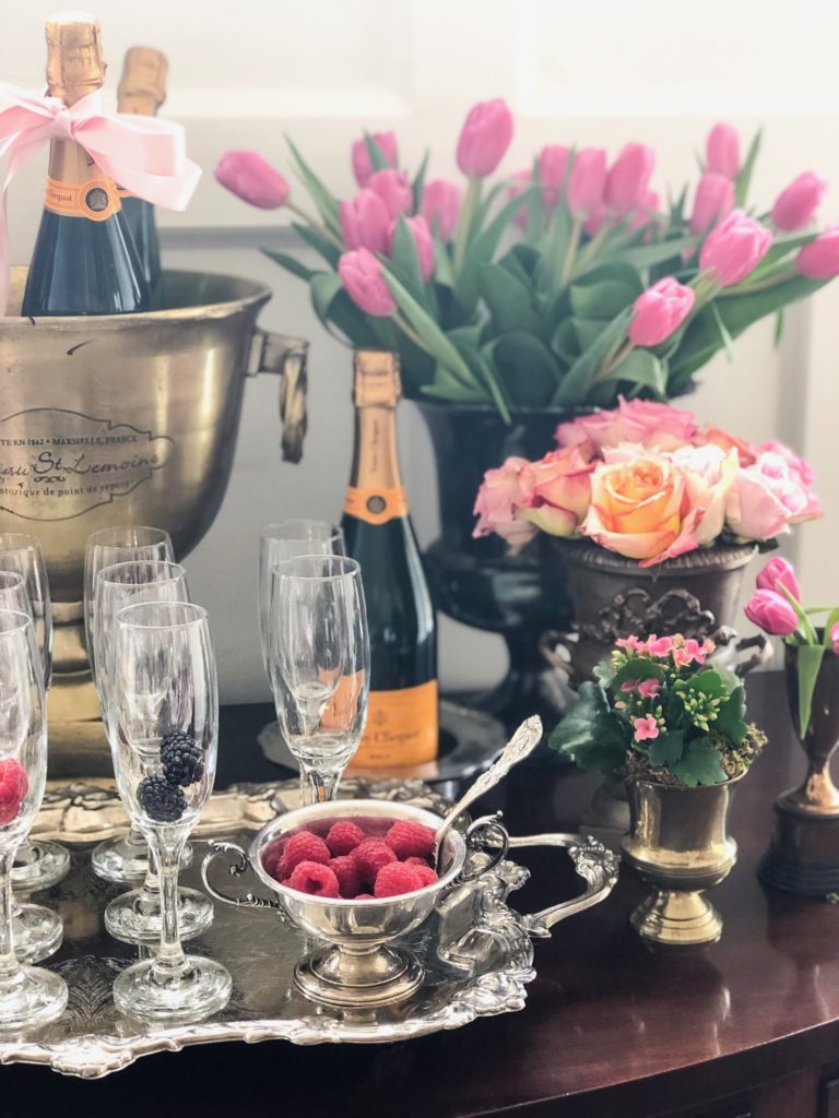 champagne brunch drink station roses and tulips in loving cups