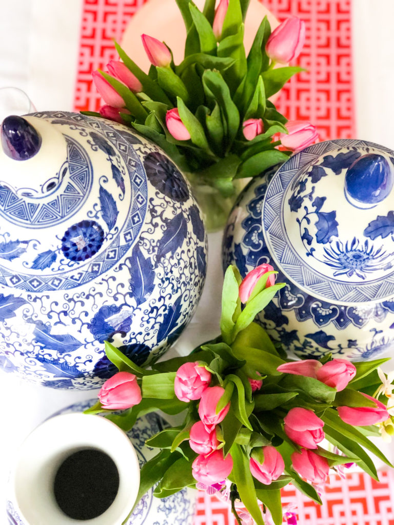 supper club love you pho real blue and white ginger jars and tulips overhead shot