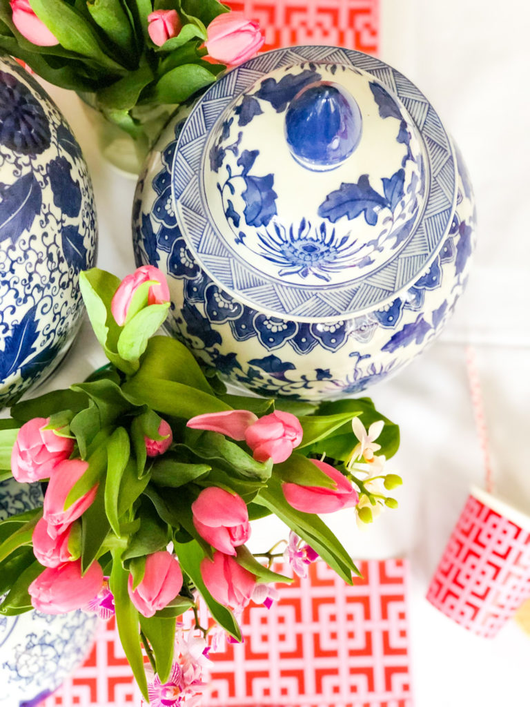 supper club love you pho real blue and white ginger jars with tulips on table