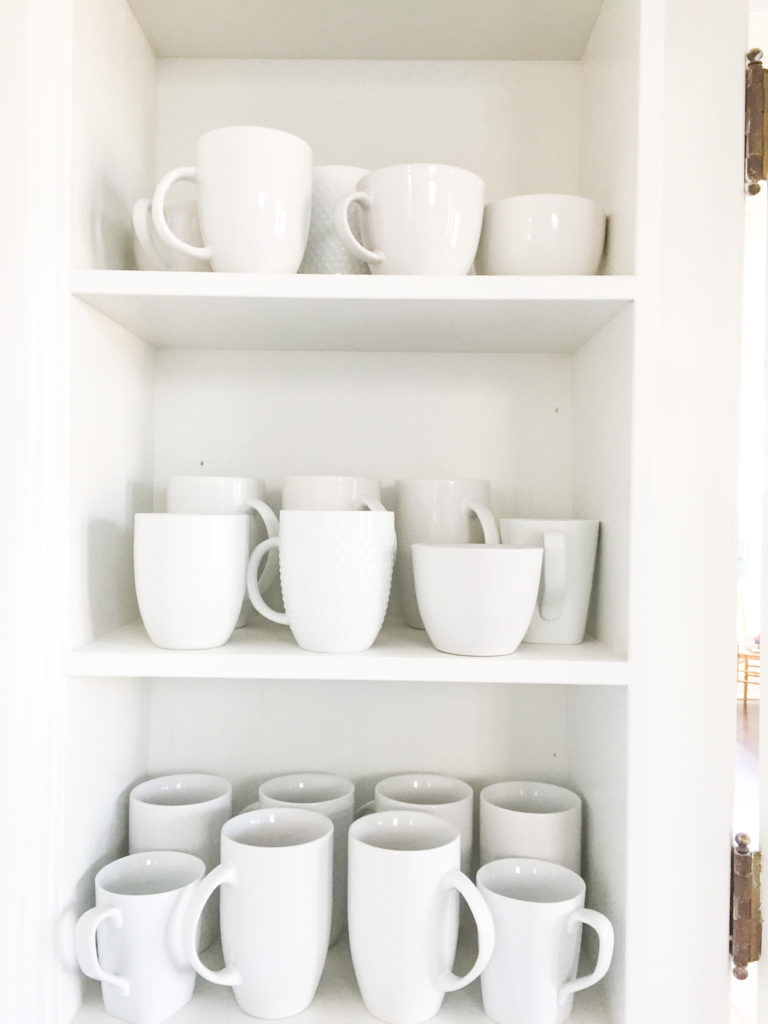 supper club shelves with white mugs