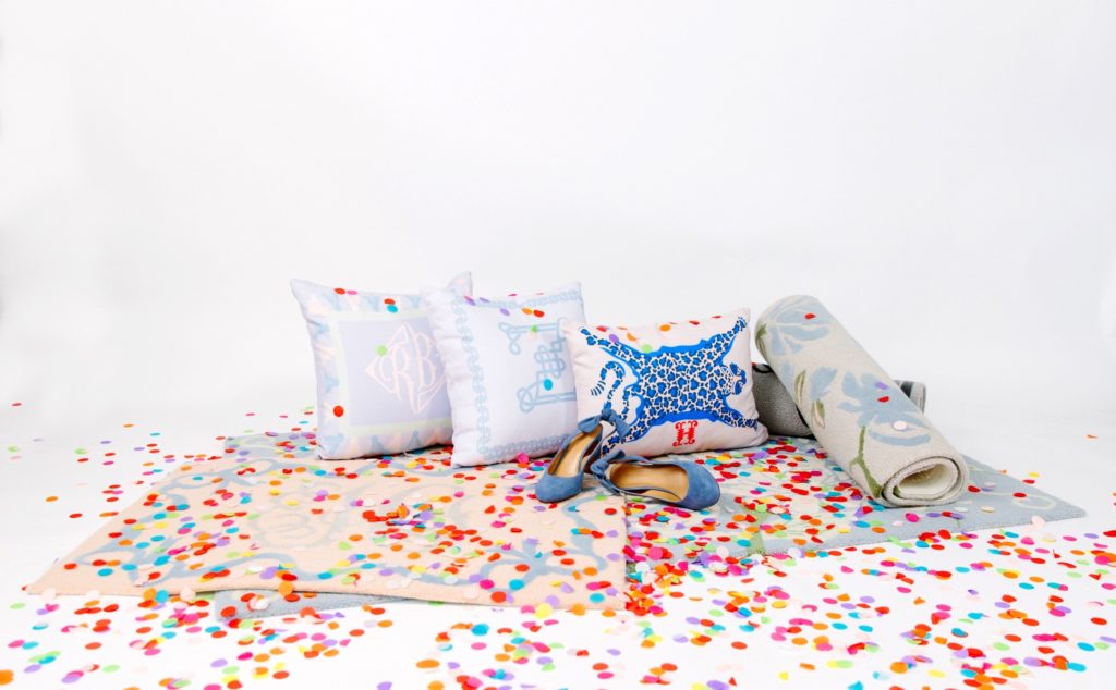 pillows on stacks or rugs with blue shoes and colorful confetti