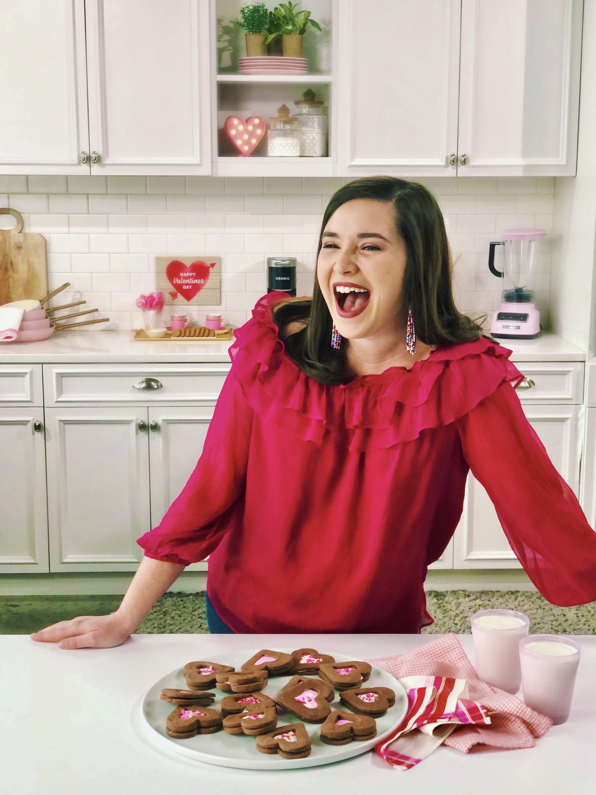 ivy odom in white kitchen laughing and making cookies