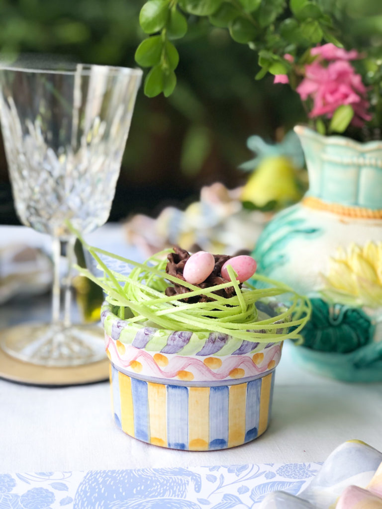 Easter edible bird nest in colorful dish with edible green grass