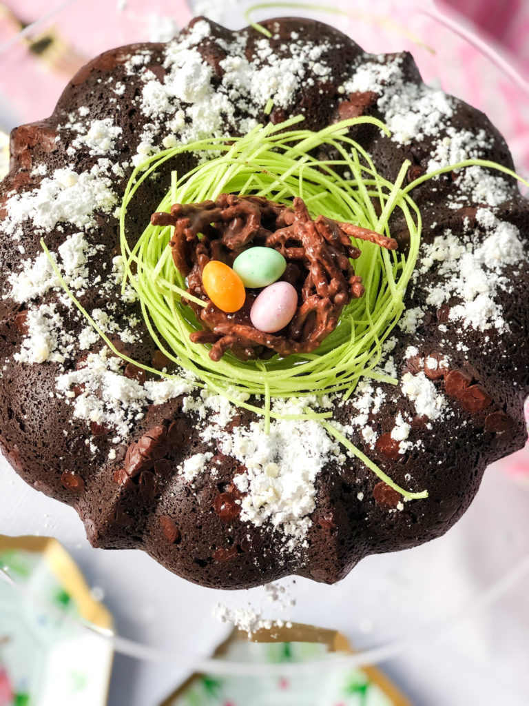 triple chocolate bundt cake with edible green grass and chocolate bird nest with jelly bean eggs
