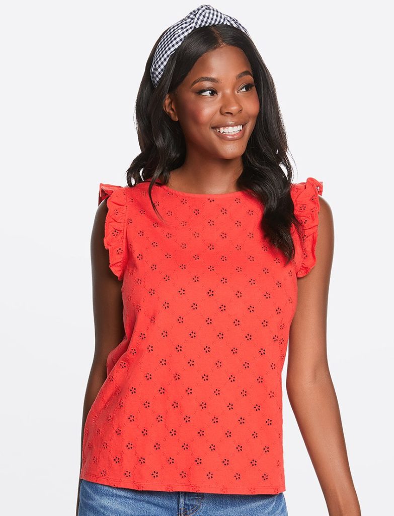 black model wearing red flutter sleeve top and blue and white gingham headband