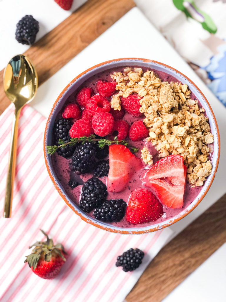 acai bowl recipe with strawberries blueberries raspberries granola and thyme