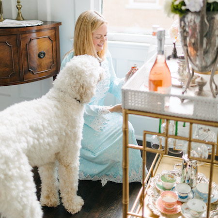 Lydia Menzies decorating a party with her dog's help!
