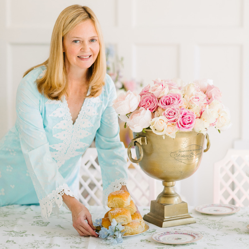 Lydia Menzies placing food on the table for Kentucky Derby celebration