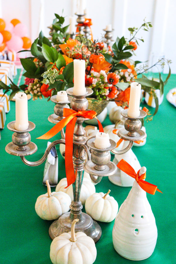 Halloween table centerpiece with flowers candelabra and ghost candles