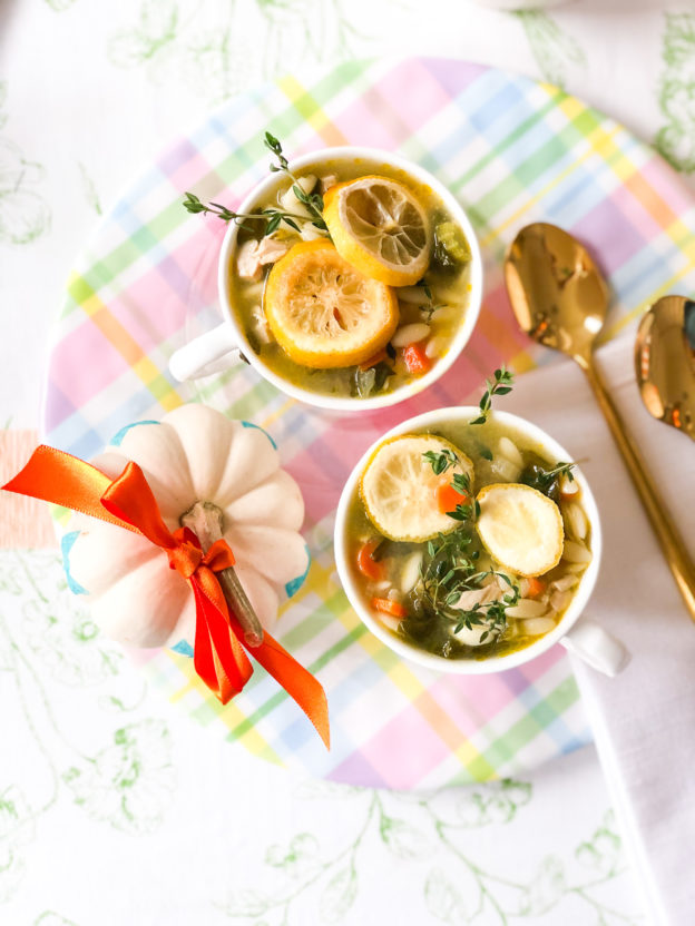 chicken orzo soup in cups on plaid plate