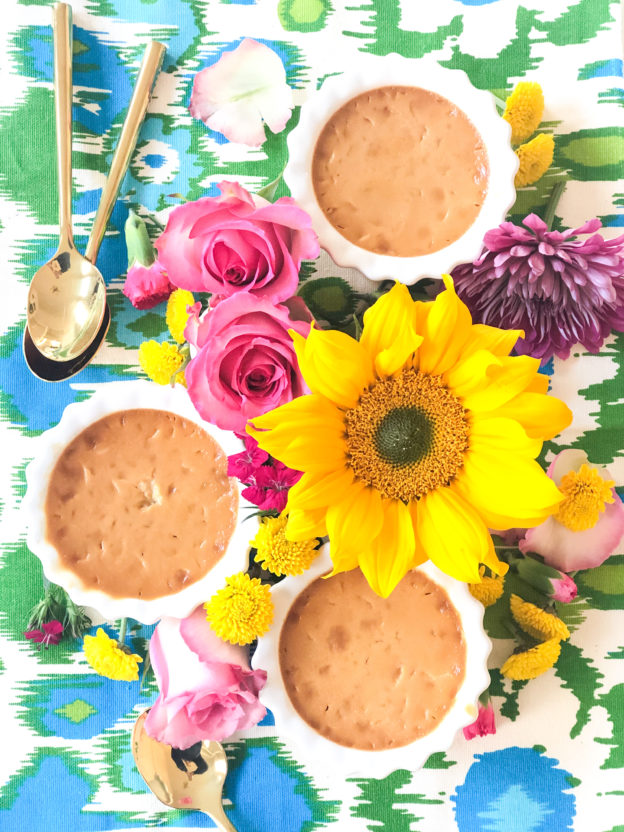 caramel pots de creme surrounded by flowers