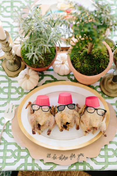 cornish hens dressed up like friends turkeys with glasses and a hat