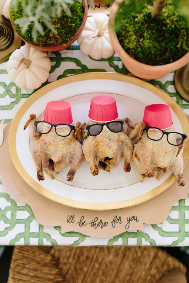 cornish hen turkeys dressed with mini glasses an red mini cups