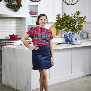 ivy odom in white kitchen with holiday outfit