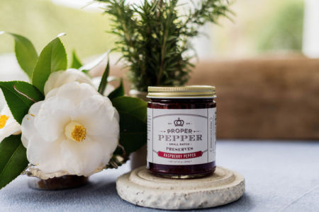 proper pepper raspberry pepper jelly with magnolia besid it
